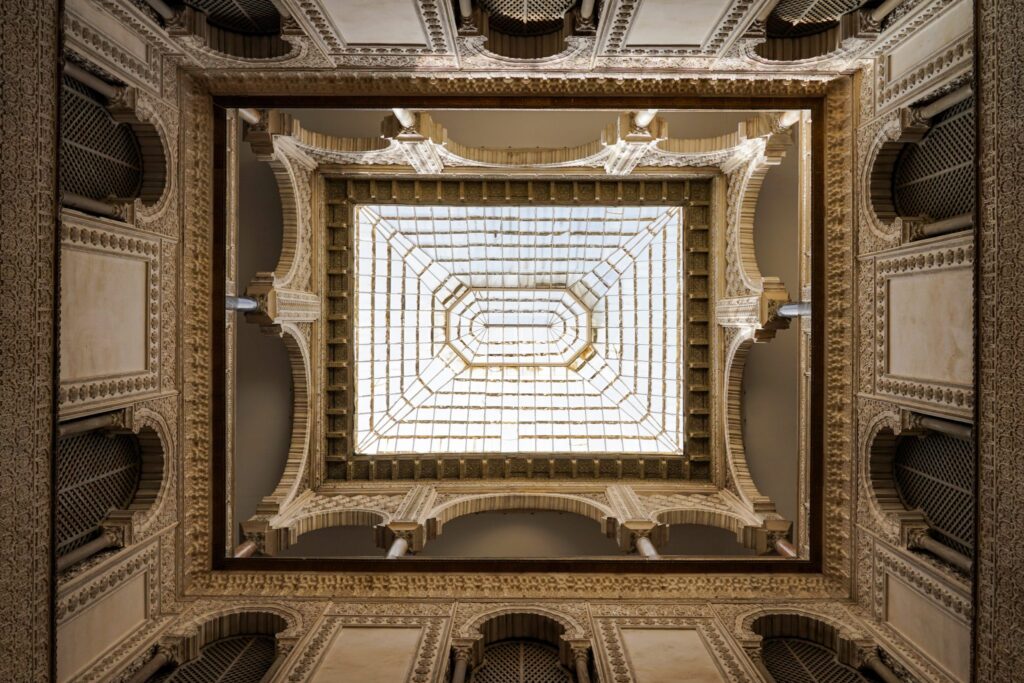 Down to top view of one of the skylights at Alcázar of Seville, historic royal palace in Spain