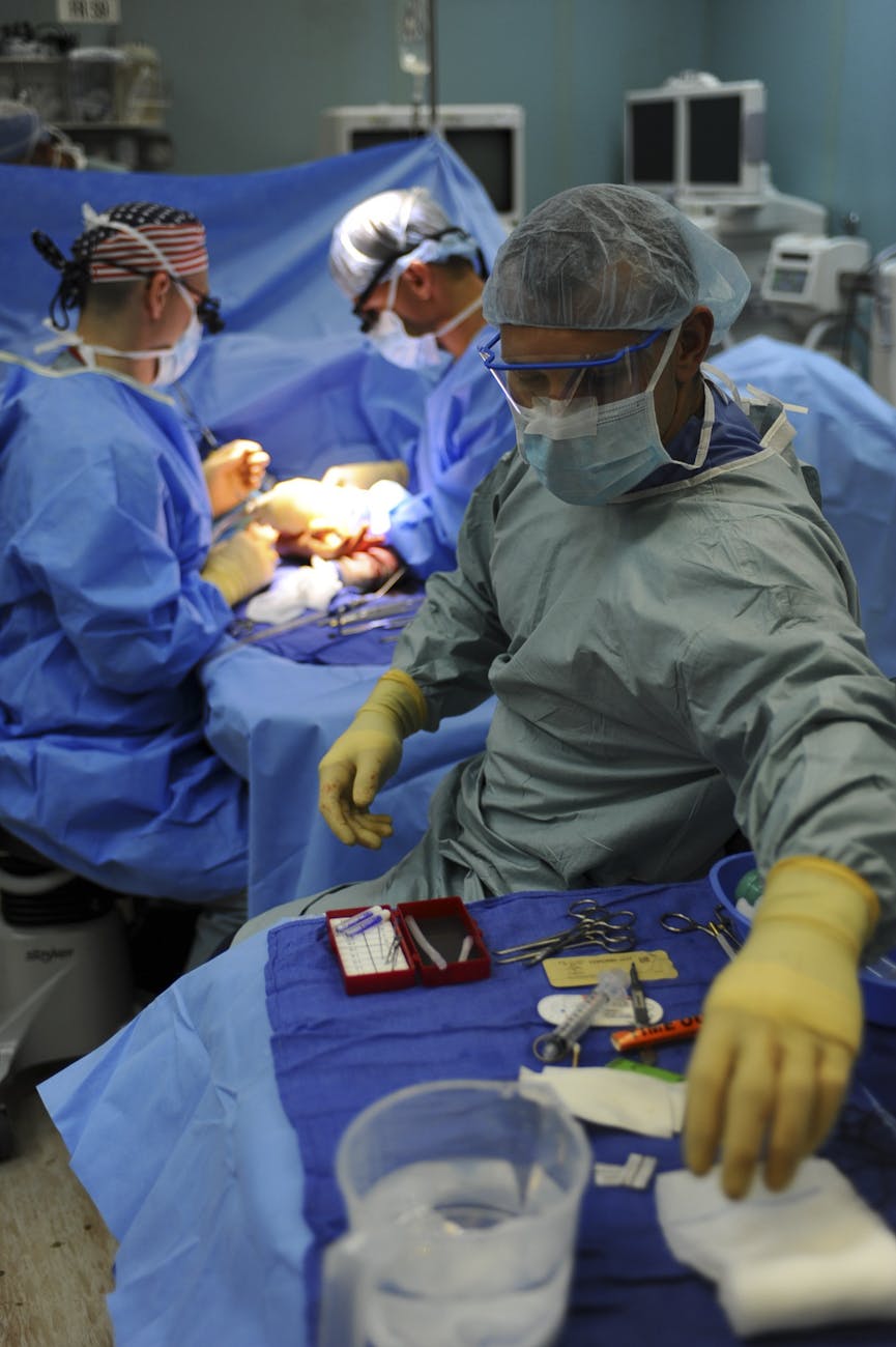 group of doctors doing operation inside room