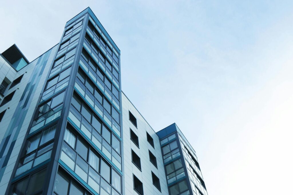 low angle view of office building against sky