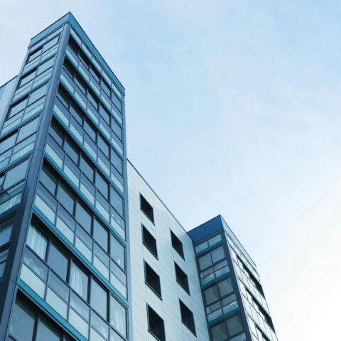 low angle view of office building against sky